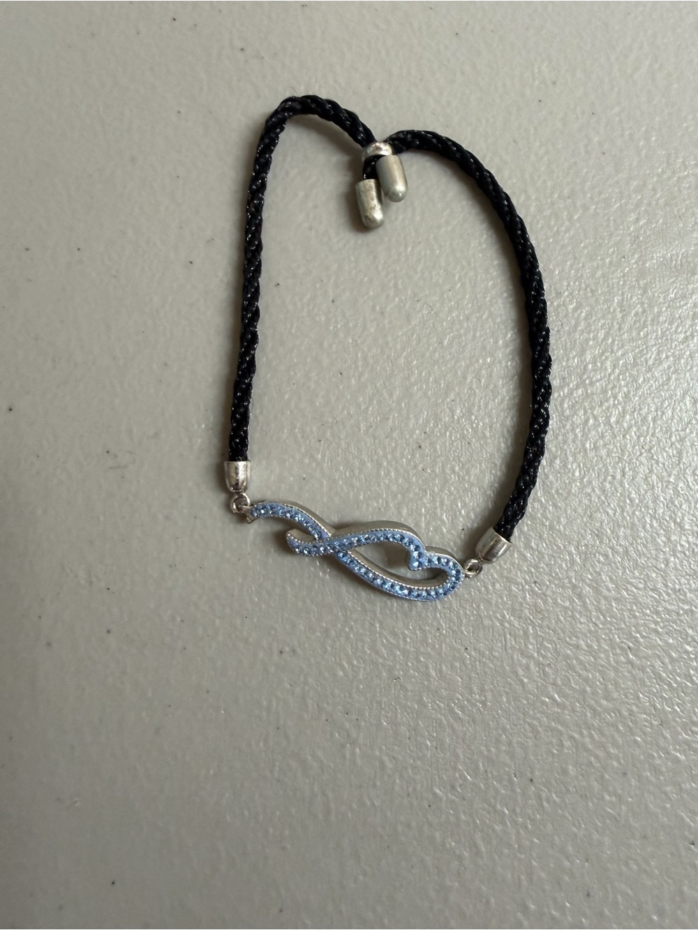 Elegant Black Cord Bracelet with Light Blue Infinity Accent